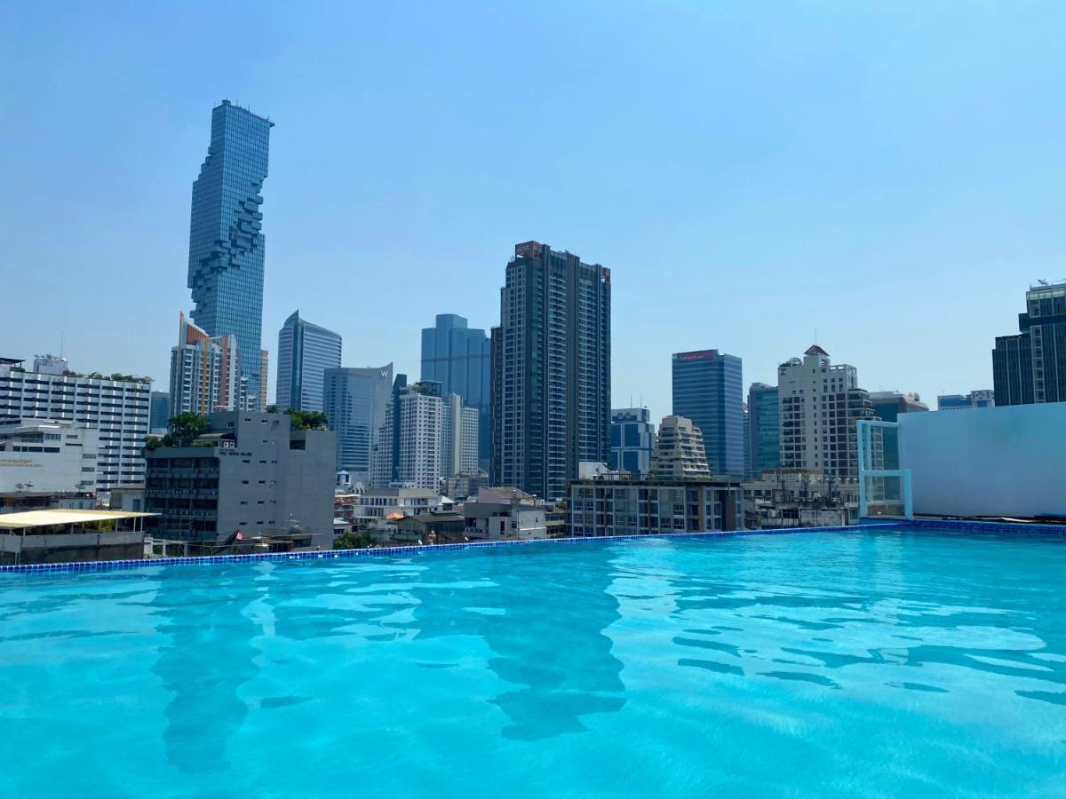 Sapphire Hotel Silom Bangkok Exterior foto View of the city from the rooftop pool